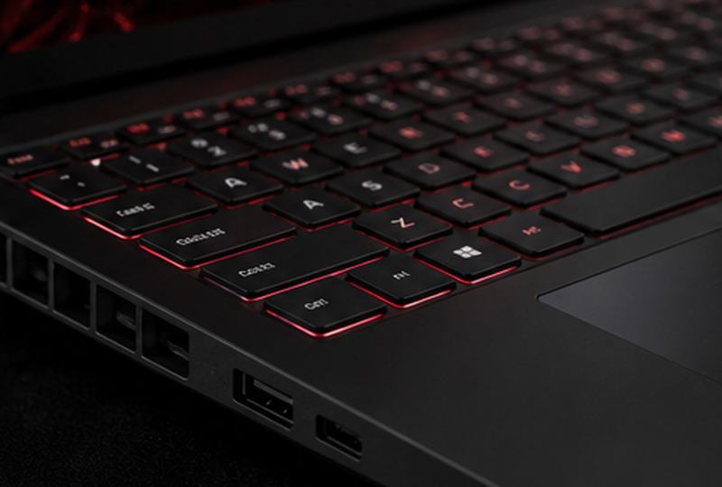 Modern laptop keyboard and desk setup